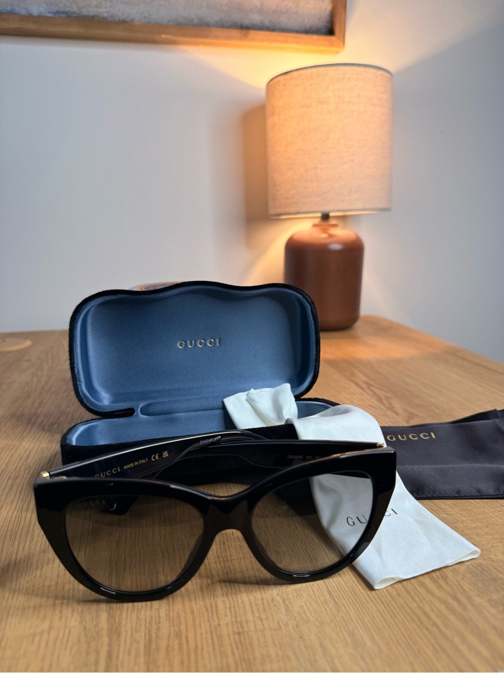 Gucci Black Cat-Eye Sunglasses with Gold Accents